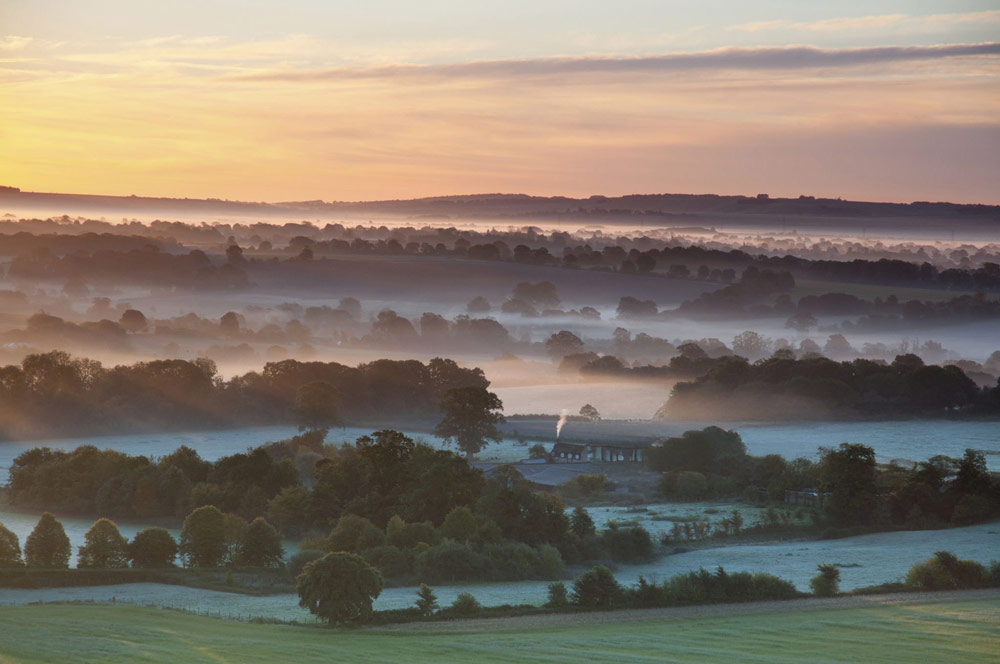 Sunrise over the Vale of Pewsey, Wiltshire, England.